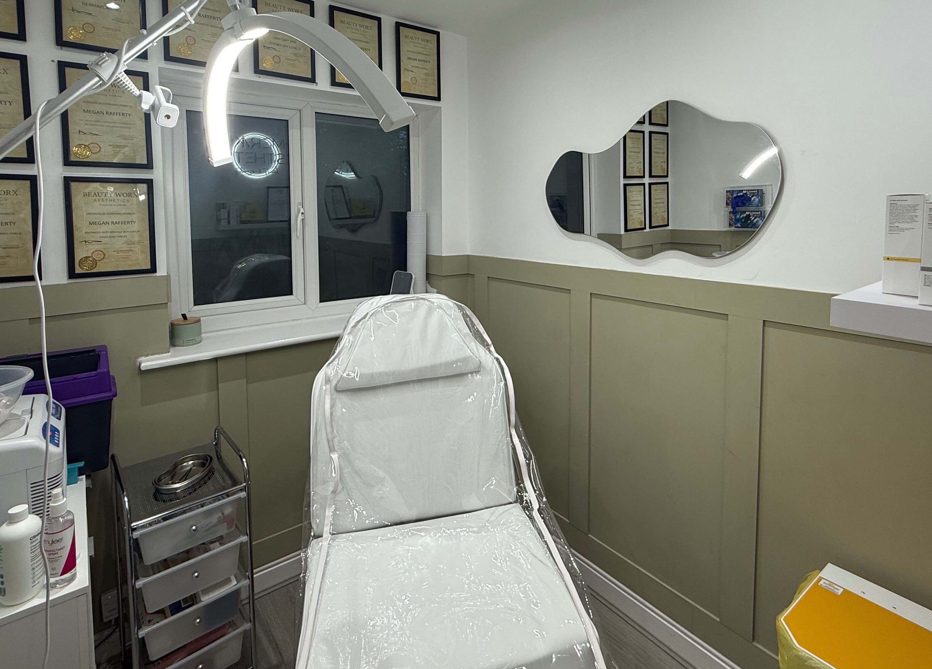 Well-equipped treatment room at Meraki Aesthetics, Eccles, England, GB showcasing beauty certificates and modern design.
