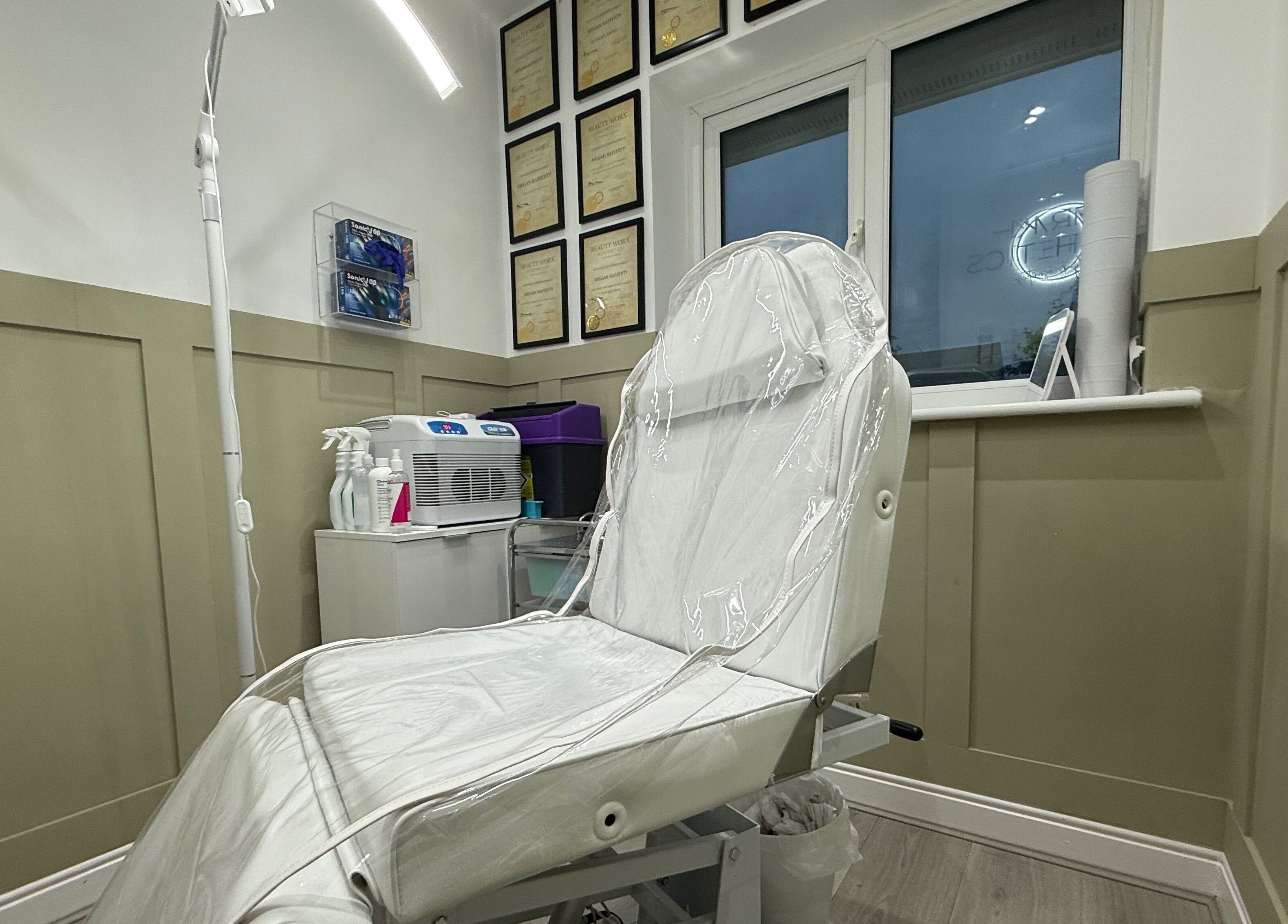 Modern aesthetic clinic room at Meraki Aesthetics in Eccles, England, GB, showcasing a pristine treatment chair.