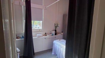 Massage room at Little Pigeon Massage and Waxing in Melbourne, Victoria, AU with serene decor and a cozy table.