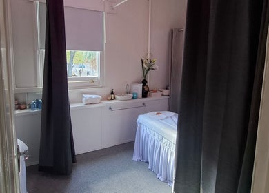 Calm massage room at Little Pigeon Massage and Waxing, Melbourne, Victoria, AU, featuring a treatment bed and soft lighting.