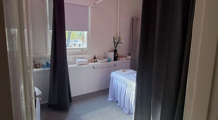 Calm massage room at Little Pigeon Massage and Waxing, Melbourne, Victoria, AU, featuring a treatment bed and soft lighting.