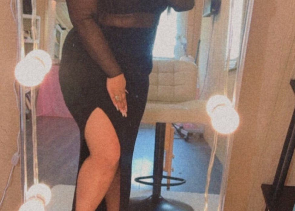 Chic woman in elegant dress at Better u lash in Moore, Oklahoma, US, showcasing beauty and style.