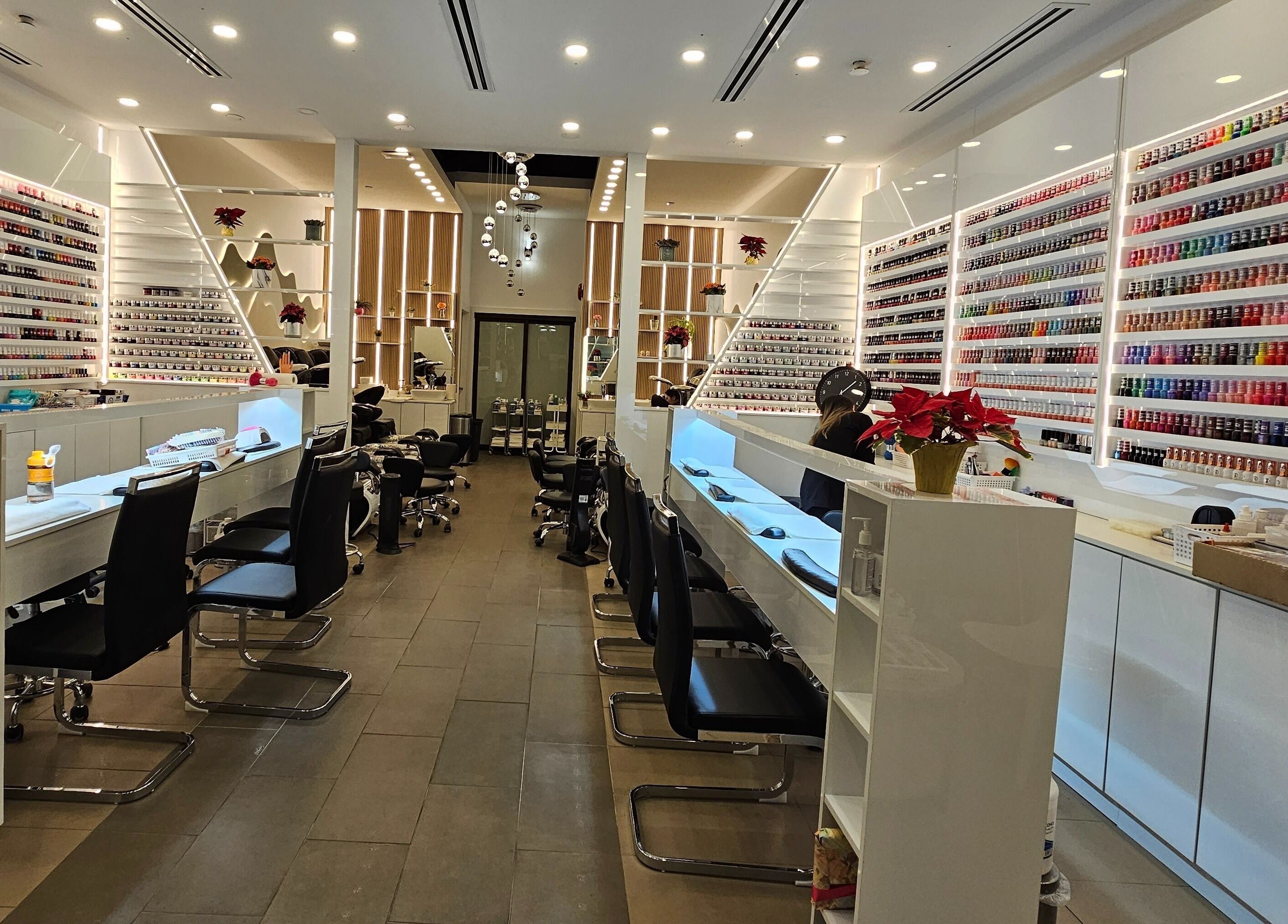 Elegant interior of All Season Nails at West Vancouver, BC, CA showcasing an array of nail polishes and modern design.