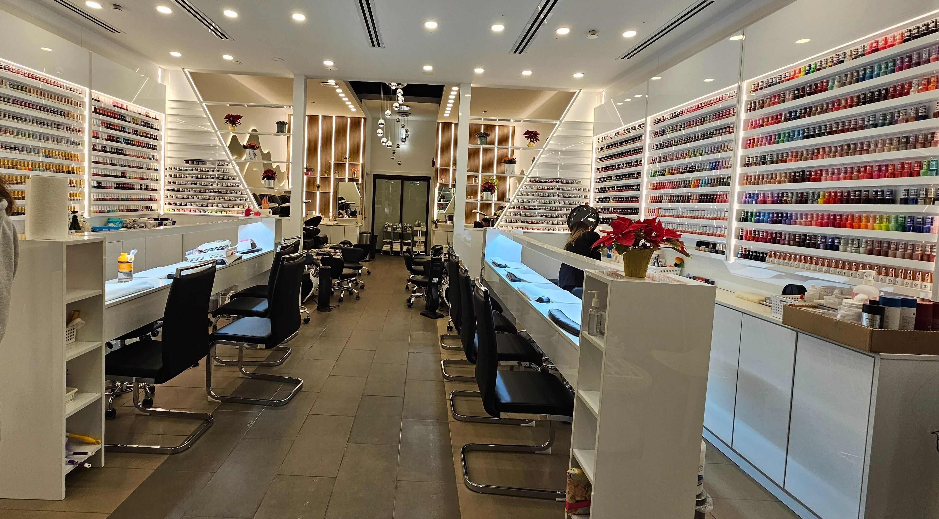 Elegant interior of All Season Nails at West Vancouver, BC, CA showcasing an array of nail polishes and modern design.