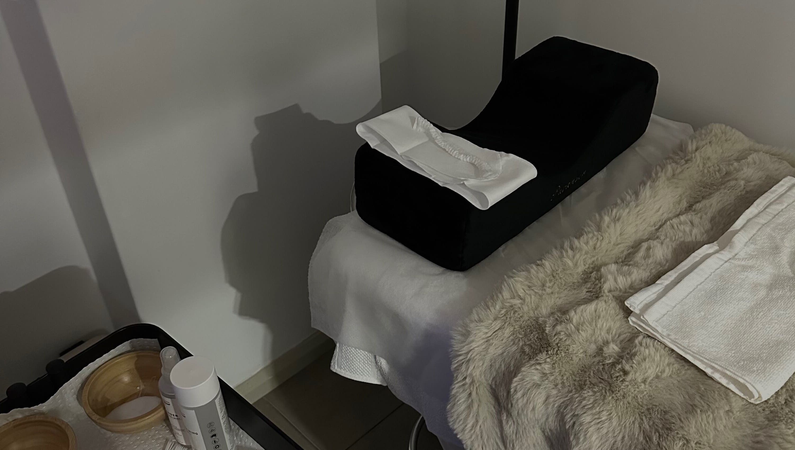 Luxury spa treatment setup at @Luxe Looks By Maria, Allawah, New South Wales, AU with plush towels and essential oils.