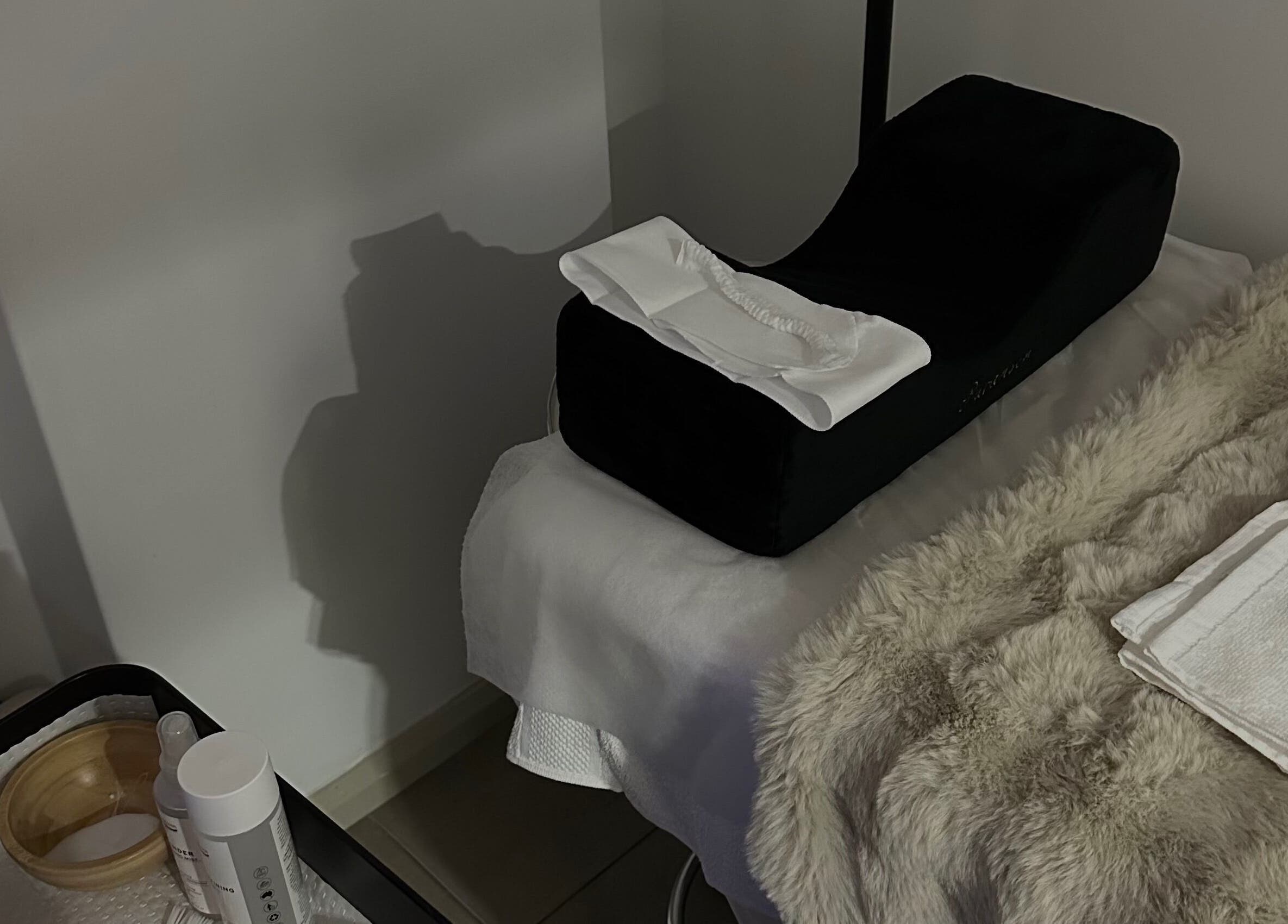 Luxury spa treatment setup at @Luxe Looks By Maria, Allawah, New South Wales, AU with plush towels and essential oils.