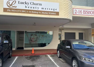 Entrance to Lucky Charm Beauty Massage in Morley, Western Australia, AU. Sleek design with parked cars.