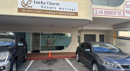 Entrance to Lucky Charm Beauty Massage in Morley, Western Australia, AU. Sleek design with parked cars.