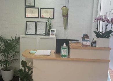 Reception area of Lucky Charm Beauty Massage in Morley, Western Australia, AU with certificates and plants.