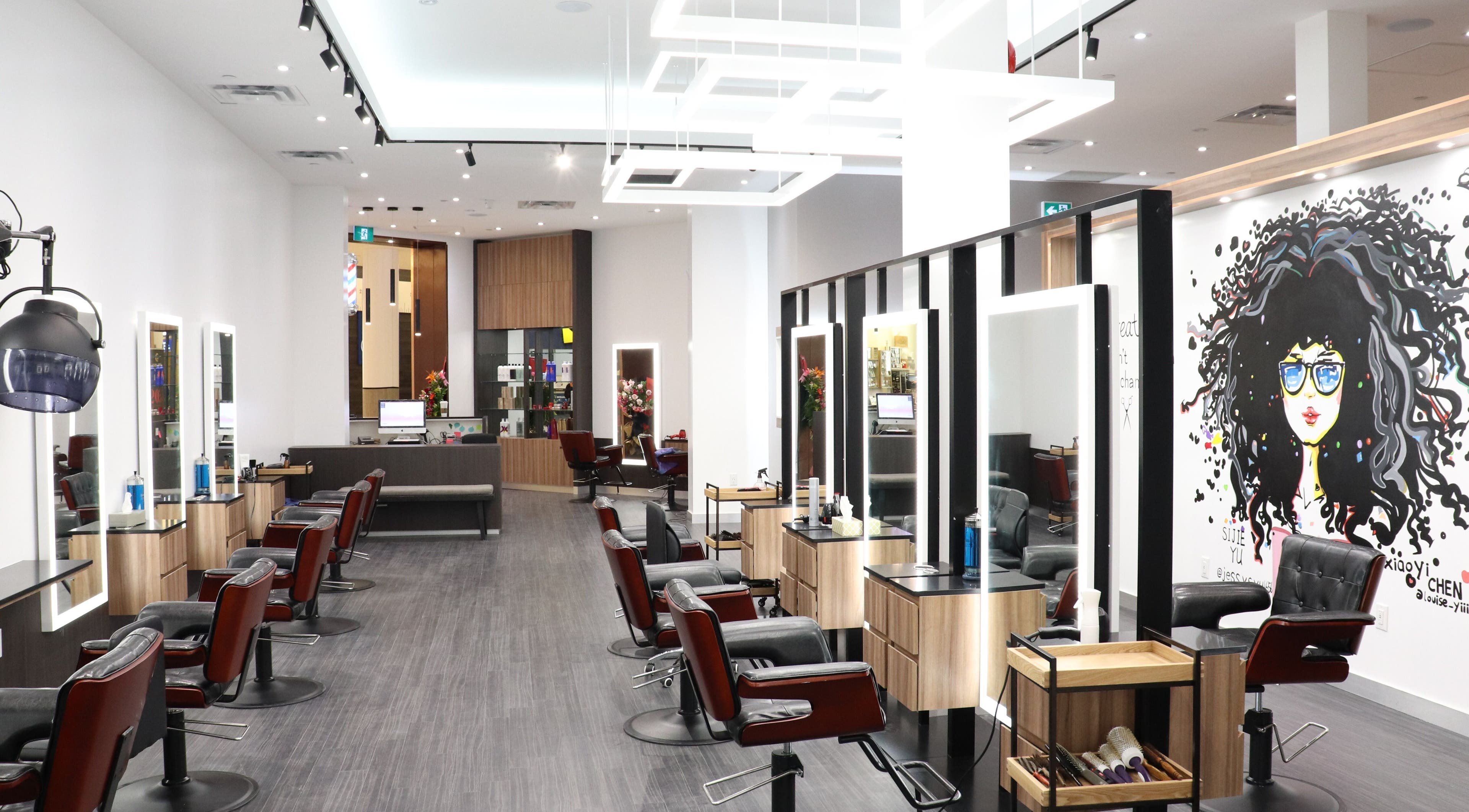 Elegant interior of Gatsby Studio Salon & Spa Markville, Markham, Ontario, CA featuring stylish salon chairs.