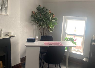 Cozy manicure station at Ellas Luxe Nails, Kirk Michael, IM with chic decor and natural light.
