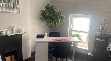 Cozy manicure station at Ellas Luxe Nails, Kirk Michael, IM with chic decor and natural light.