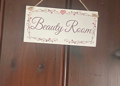 Charming Beauty Room sign at Ellas Luxe Nails, Kirk Michael, IM, welcoming clients with elegance.
