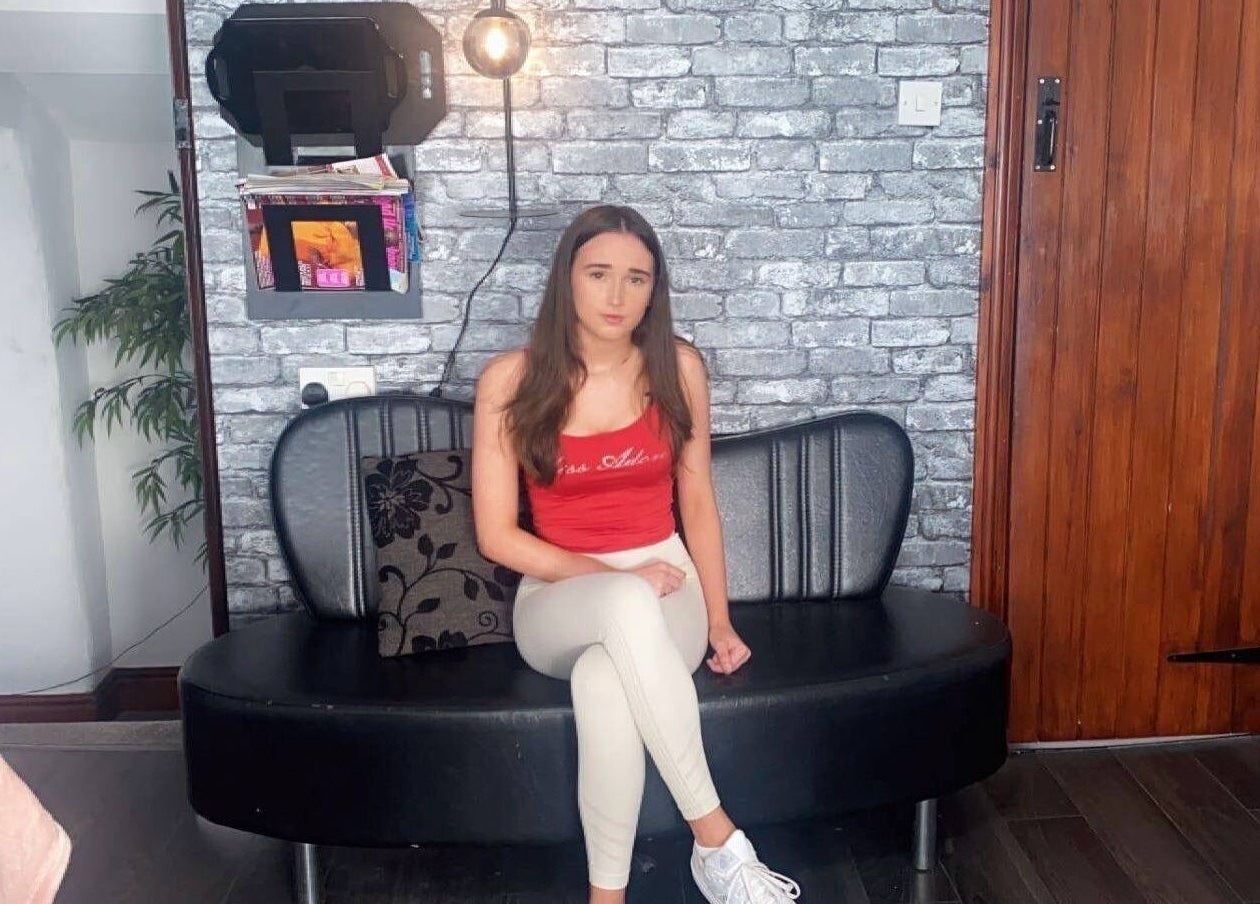 Stylish seating at Ellas Luxe Nails, Kirk Michael, IM with a modern brick wall and cozy decor.