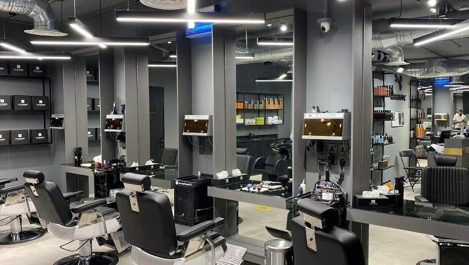 Sleek interior of Al Rayan | 30 Degrees Barbershop, Riyadh, with modern barber chairs and elegant mirrors.