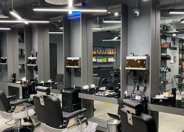 Sleek interior of Al Rayan | 30 Degrees Barbershop, Riyadh, with modern barber chairs and elegant mirrors.