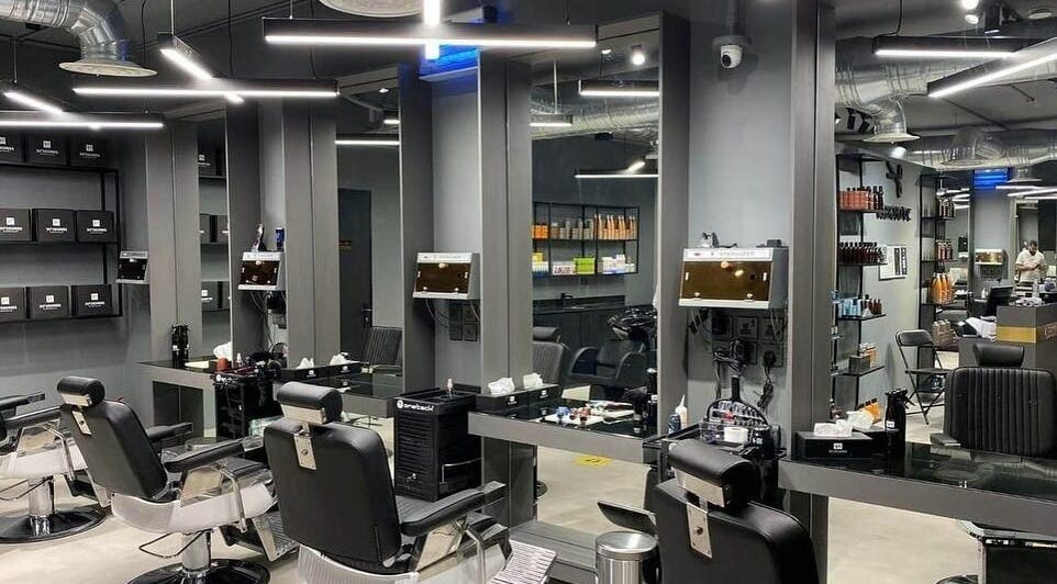 Sleek interior of Al Rayan | 30 Degrees Barbershop, Riyadh, with modern barber chairs and elegant mirrors.