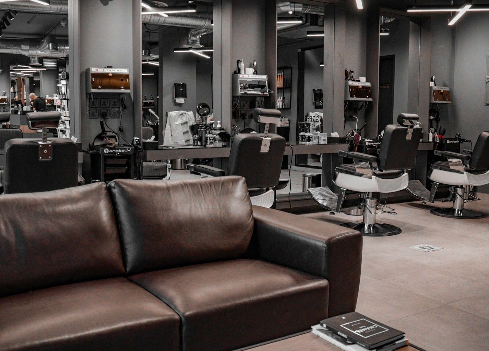Sleek interior of Al Izdihar 30 Degrees Barbershop in Riyadh, Riyadh Province, SA with stylish chairs and mirrors.