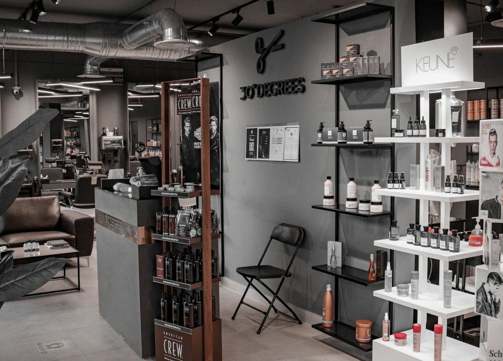 Inside Al Izdihar 30 Degrees Barbershop, showcasing stylish product displays in Riyadh, Riyadh Province, SA.