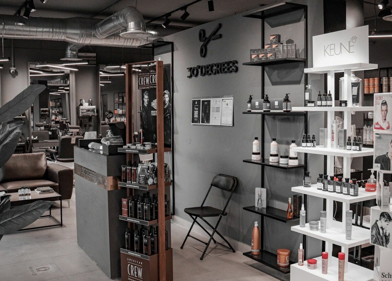 Inside Al Izdihar 30 Degrees Barbershop, showcasing stylish product displays in Riyadh, Riyadh Province, SA.