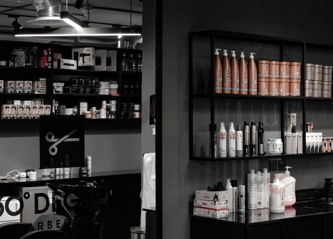 Shelves with hair products at Al Izdihar 30 Degrees Barbershop in Riyadh, Riyadh Province, SA.