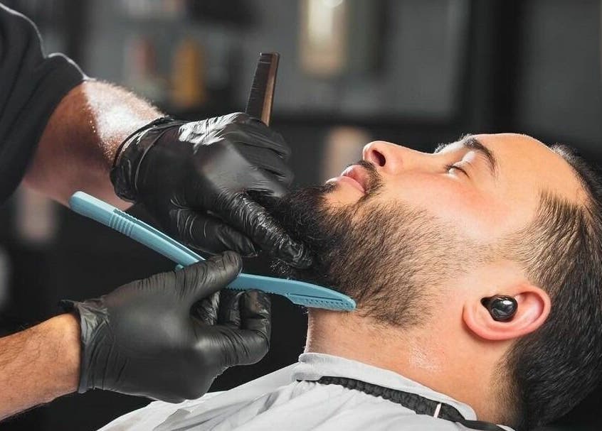 Close-up of a beard grooming session at Al Izdihar 30 Degrees Barbershop in Riyadh, Riyadh Province, SA.