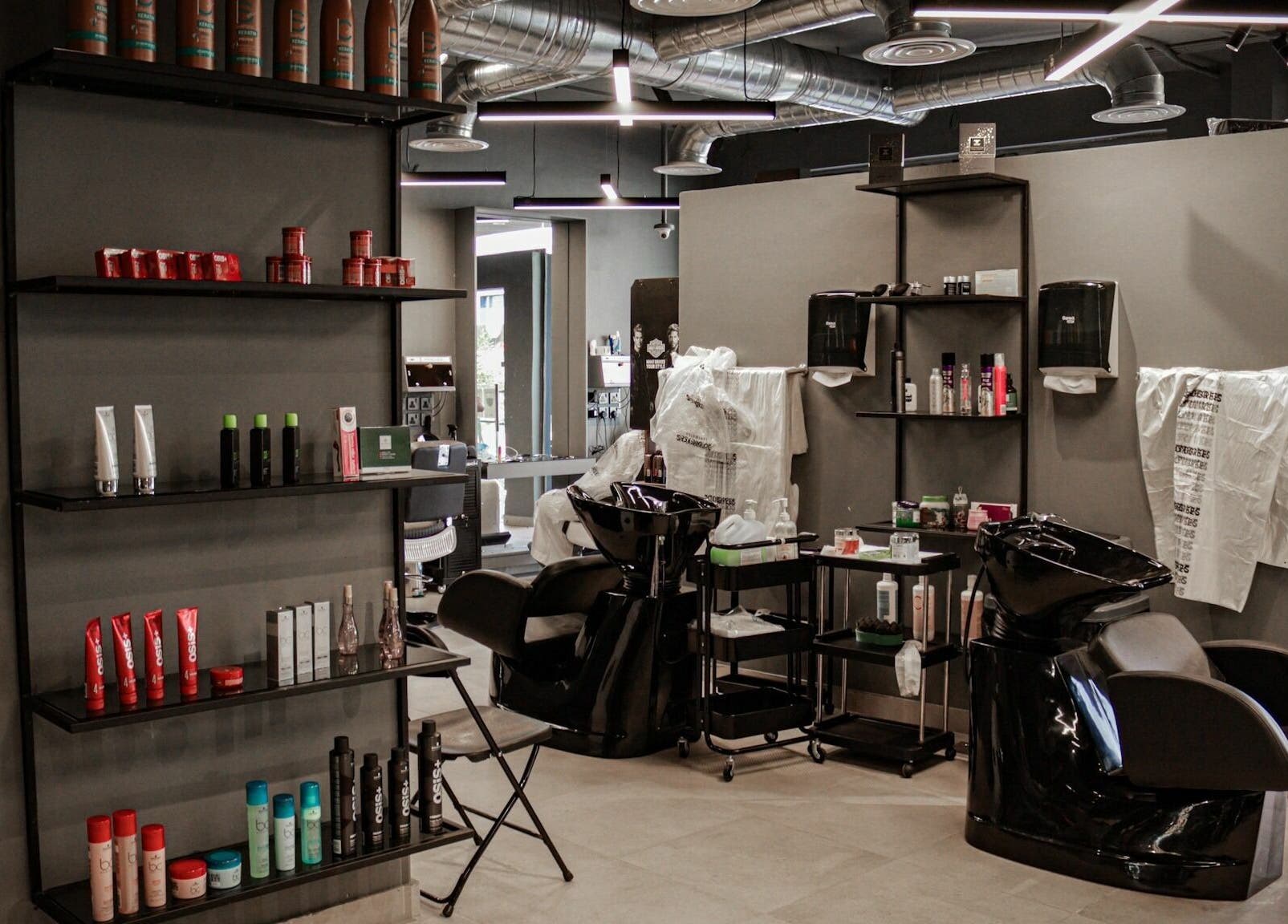 Al Hamra | 30 Degrees Barbershop interior showcases sleek salon chairs and product shelves in Riyadh, Riyadh Province, SA.