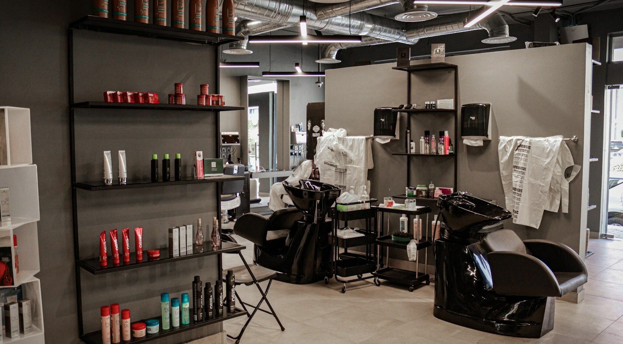 Al Hamra | 30 Degrees Barbershop interior showcases sleek salon chairs and product shelves in Riyadh, Riyadh Province, SA.