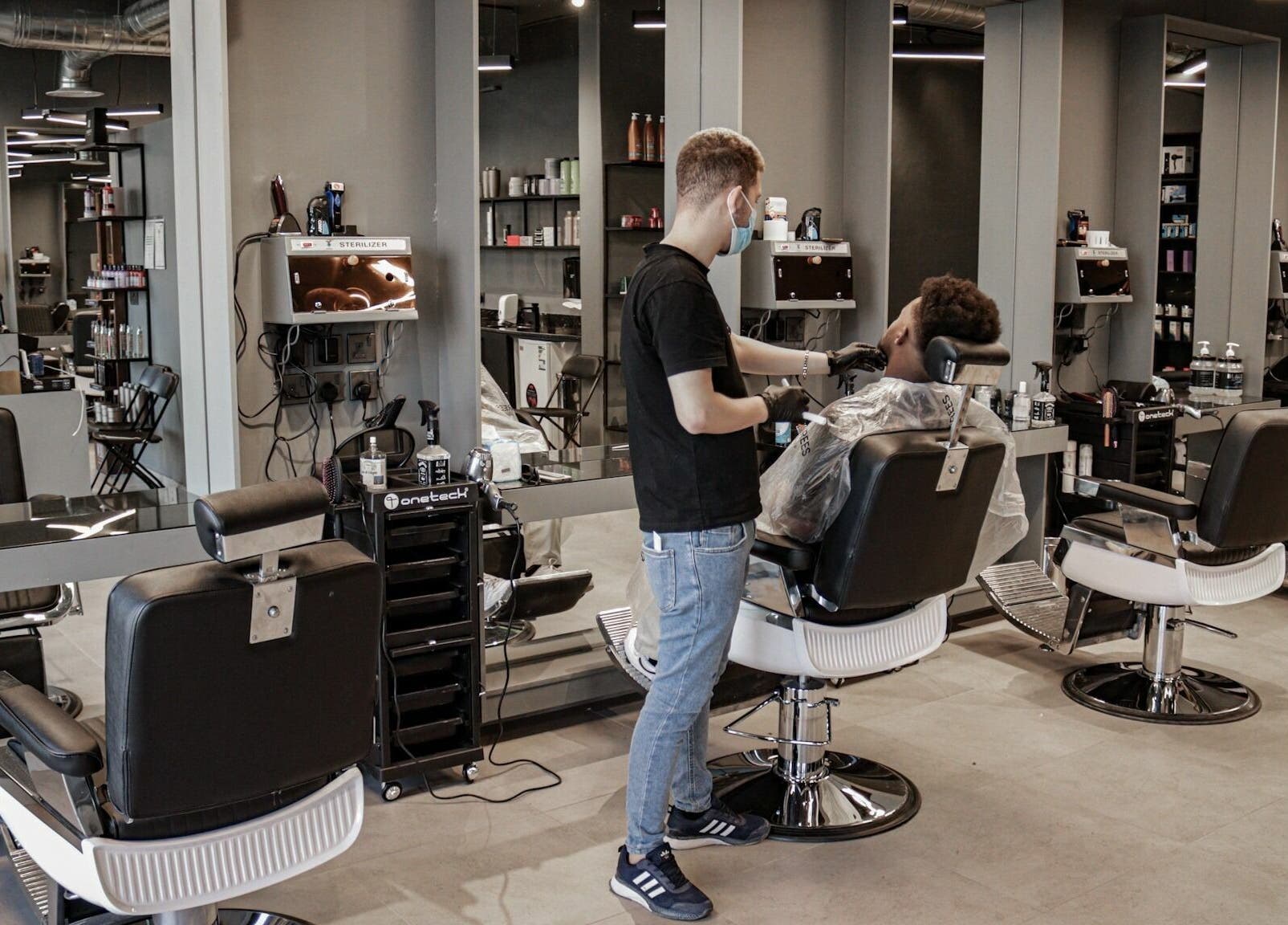 Barber styling client at Al Hamra | 30 Degrees Barbershop, Riyadh, Riyadh Province, SA.