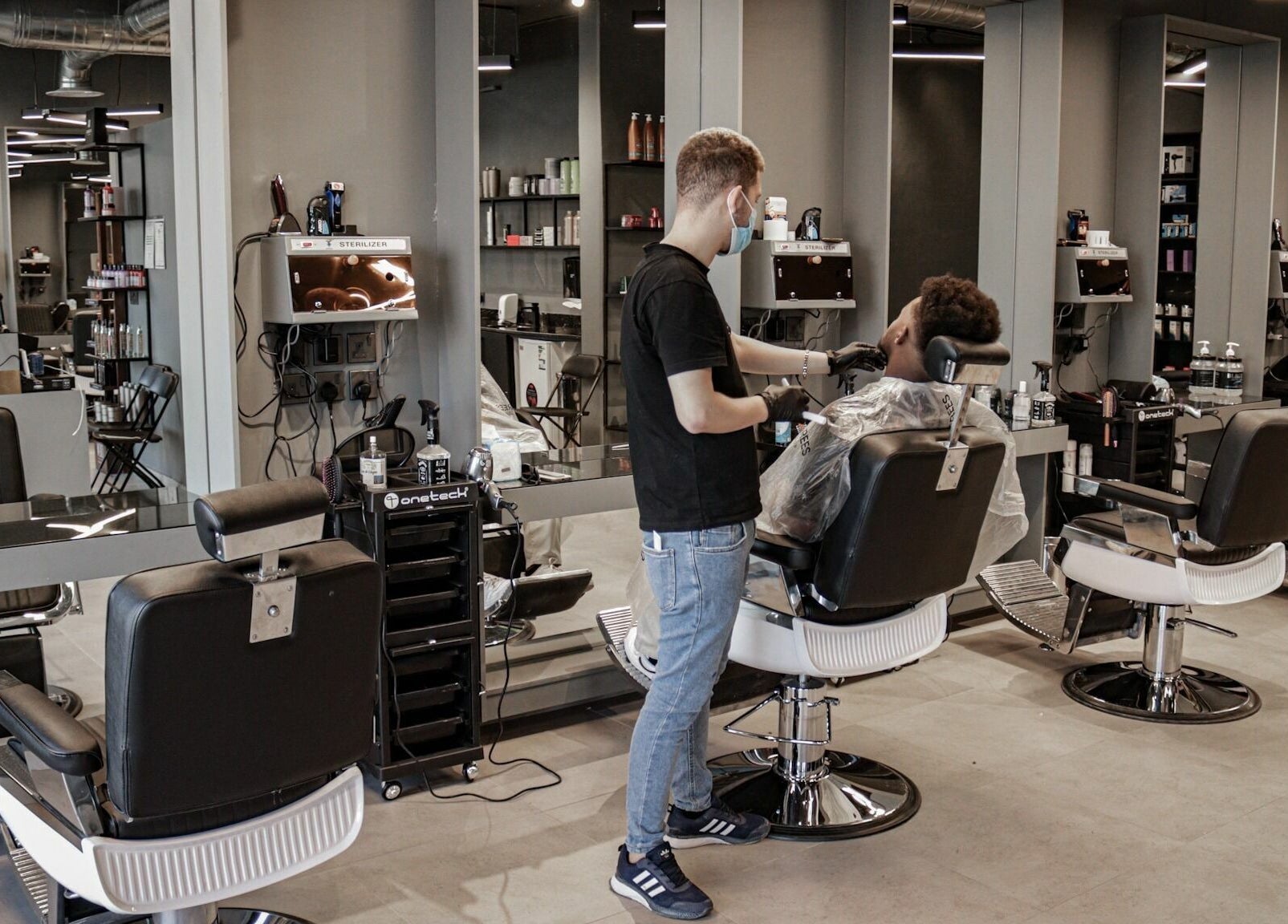 Barber styling client at Al Hamra | 30 Degrees Barbershop, Riyadh, Riyadh Province, SA.