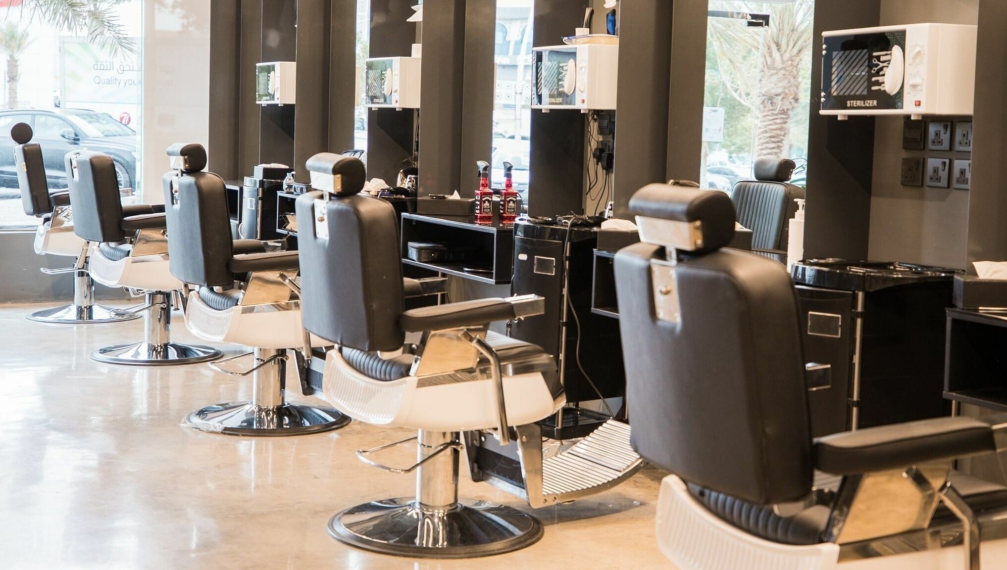 Interior of Al Khobar 30 Degrees Barbershop, Olaya Branch in Al Khobar, Eastern Province, SA with modern chairs.