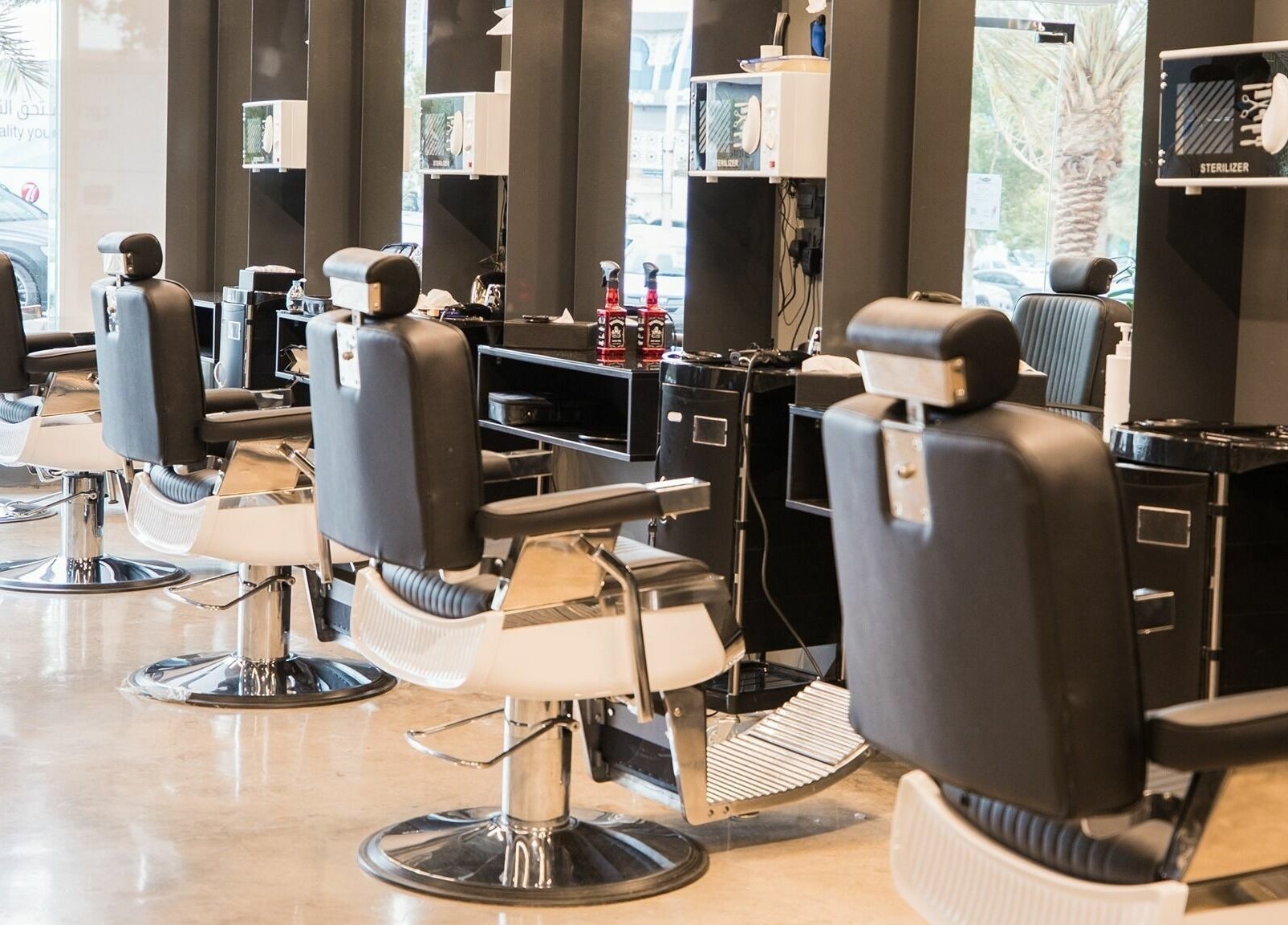 Interior of Al Khobar 30 Degrees Barbershop, Olaya Branch in Al Khobar, Eastern Province, SA with modern chairs.
