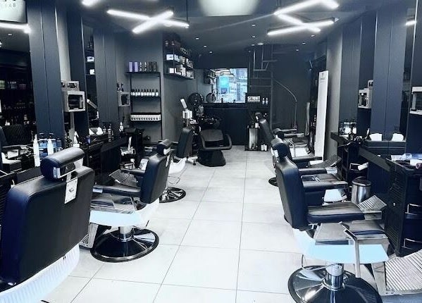 Interior of Al Khobar 30 Degrees Barbershop, Olaya Branch in Al Khobar, Eastern Province, SA with sleek chairs.