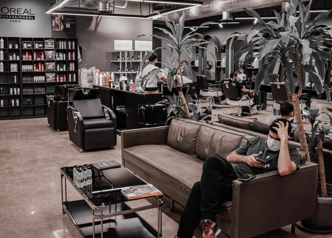 Interior of Al Mohamadyah 30 Degrees Barbershop in Riyadh showcasing stylish décor and seating area.