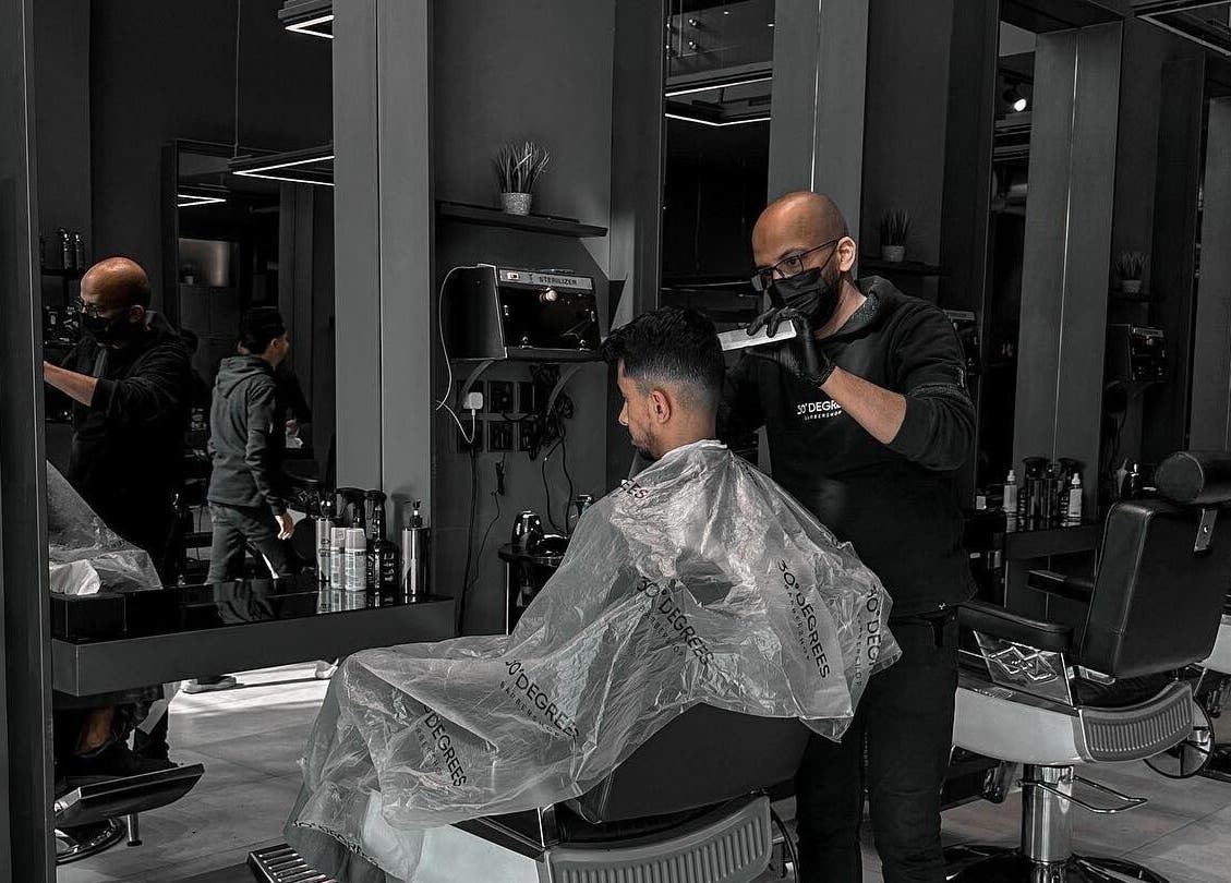 Haircut in progress at Al Mohamadyah 30 Degrees Barbershop, Riyadh, Riyadh Province, SA.