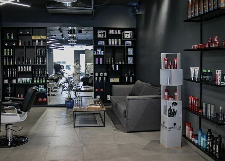 Almahdiyah 30 Degrees Barbershop interior, stylish seating and grooming products in Riyadh, Riyadh Province, SA.