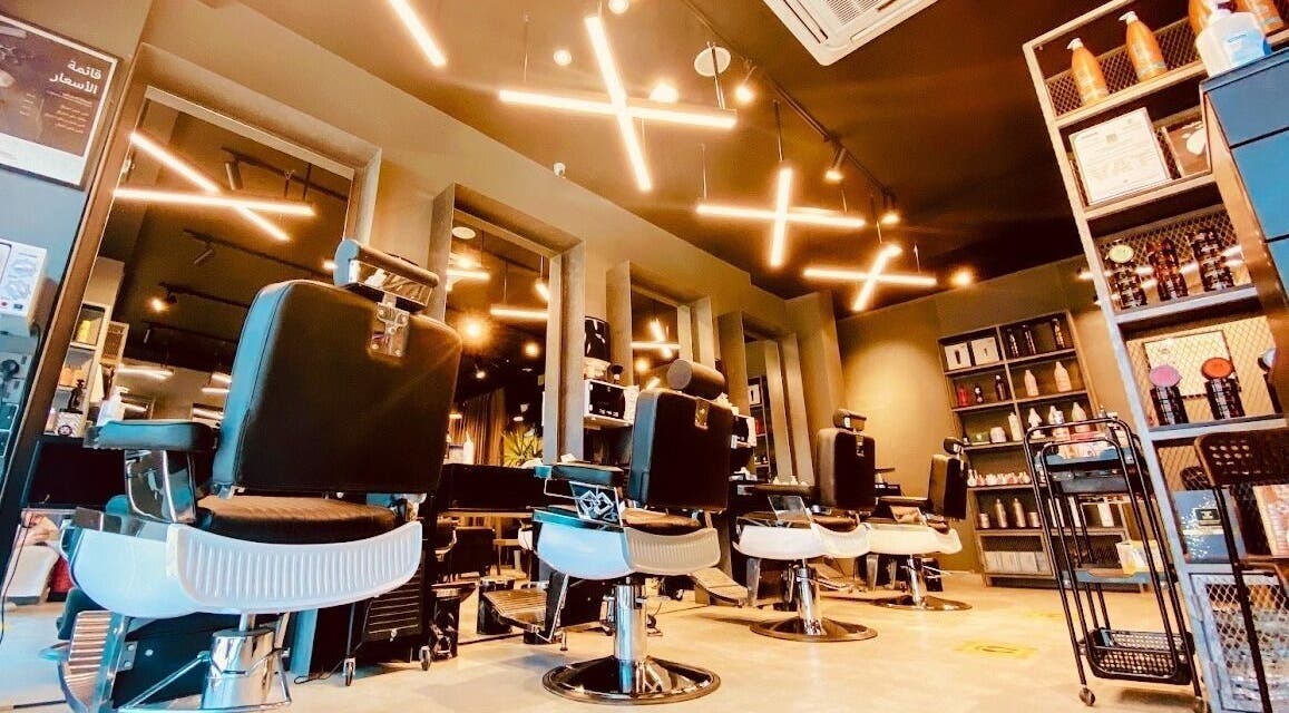 Modern interior of Qurtubah 30 Degrees Barbershop in Riyadh, Riyadh Province, SA, featuring stylish barber chairs.