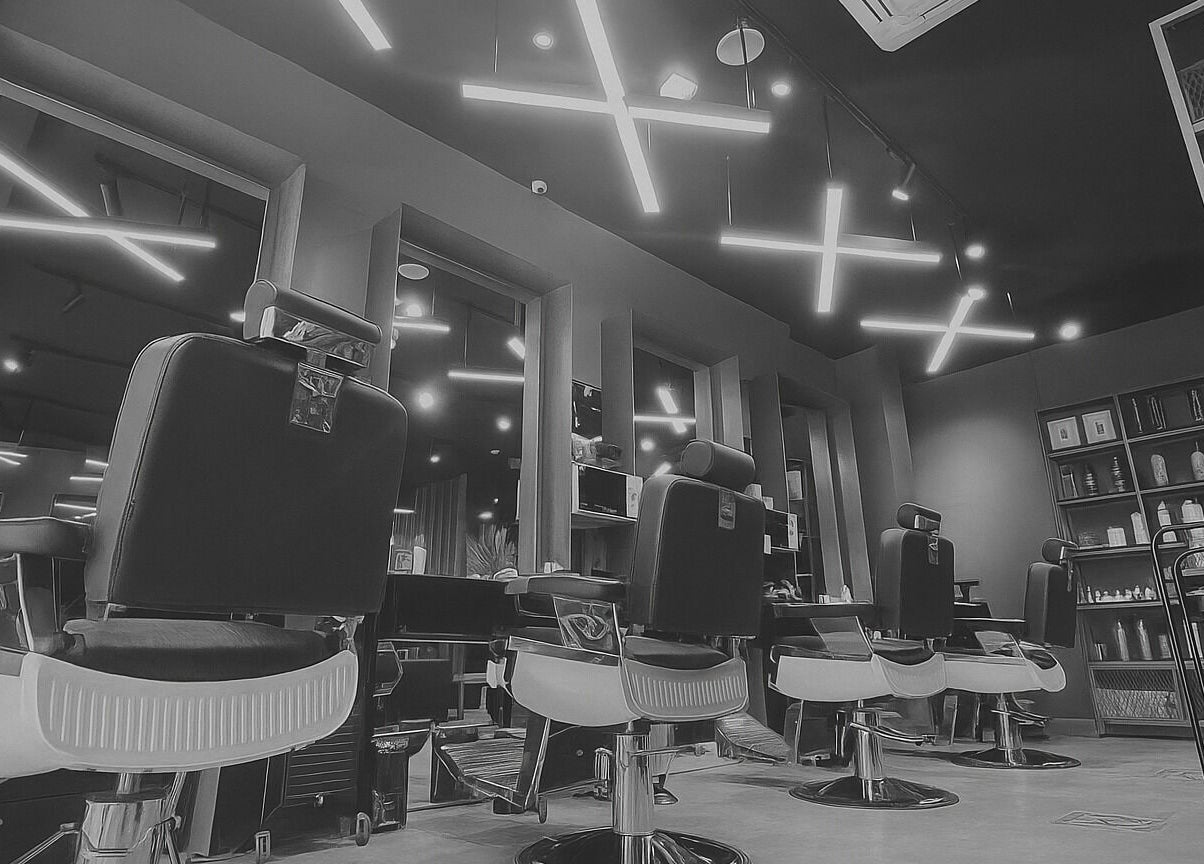 Modern interior of Qurtubah 30 Degrees Barbershop in Riyadh, Riyadh Province, SA with stylish barber chairs.