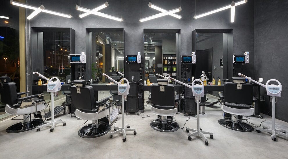 Modern interior of Al Nakheel 30 Degrees Barbershop in Riyadh, Riyadh Province, SA with sleek styling chairs.
