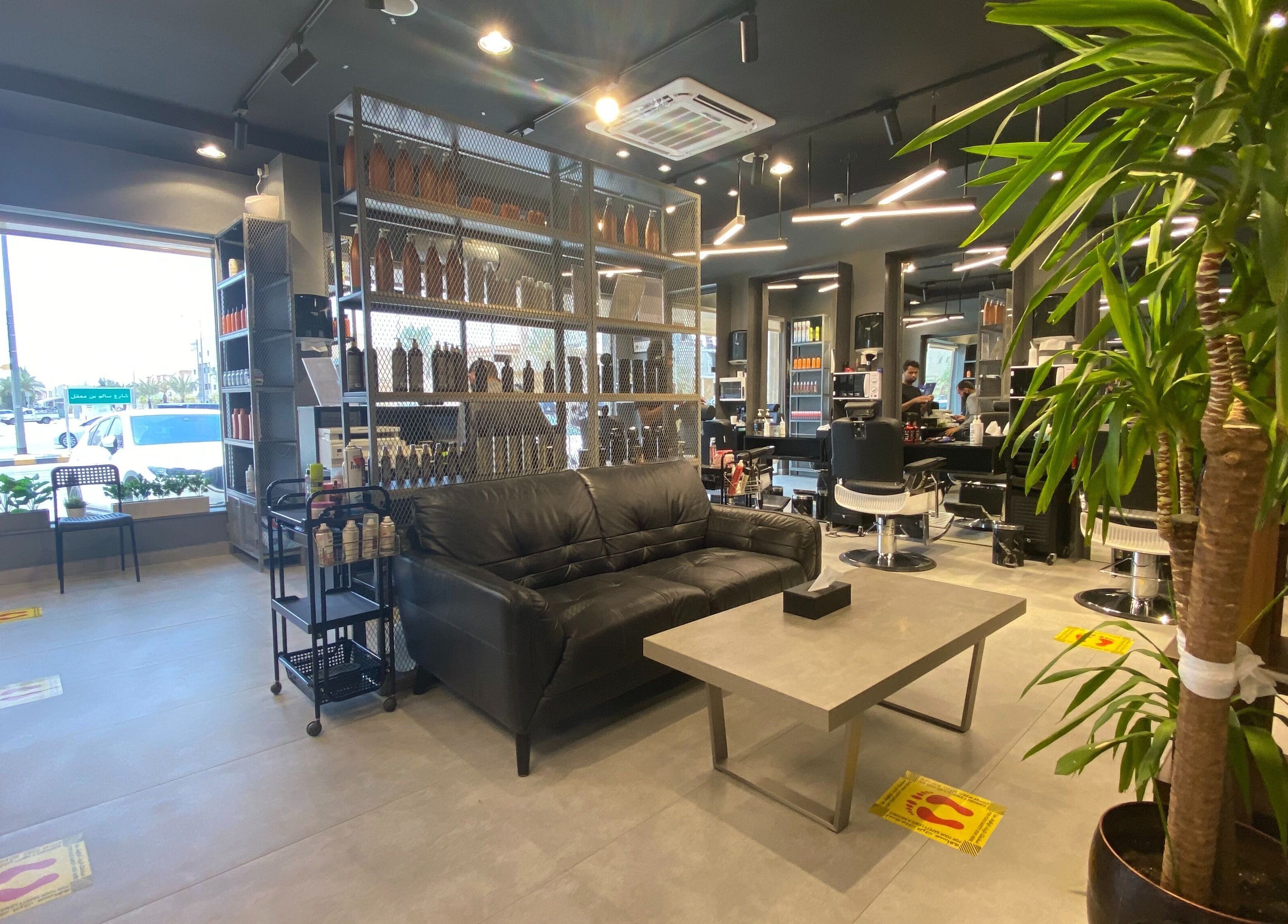 Modern interior of Al Nakheel 30 Degrees Barbershop in Riyadh, Riyadh Province, SA with sleek seating and decor.
