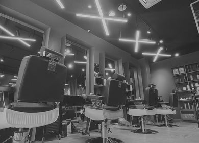 Modern interior of Al Nakheel 30 Degrees Barbershop in Riyadh, Riyadh Province, SA featuring stylish barber chairs.