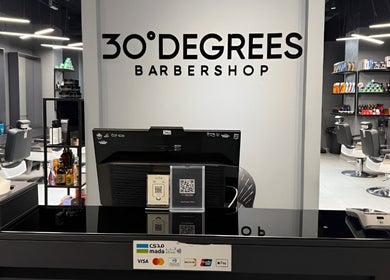 Reception desk at Jeddah 30 Degrees Barbershop Alnaeem, Jeddah, Makkah Province, SA featuring chairs and products.