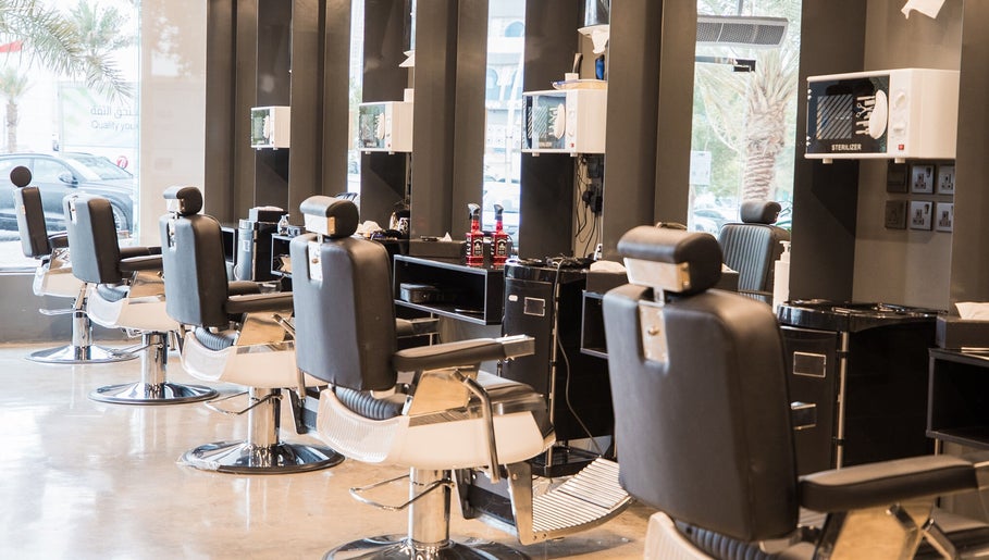 Modern barber chairs at 30 Degrees Barbershop, Makkah, Makkah Province, SA, offering a stylish grooming experience.