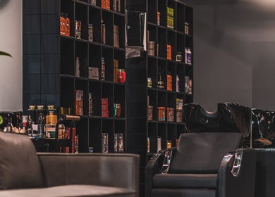 Elegant styling station at 30 Degrees Barbershop, Makkah, Makkah Province, SA, featuring sleek barber chairs.