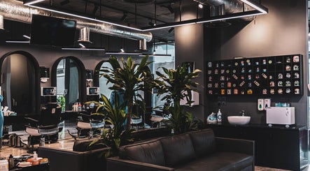 Modern interior of 30 Degrees Barbershop, Makkah with stylish decor and grooming products on display.