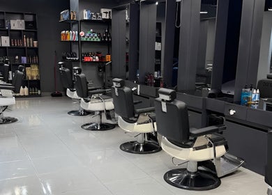 Modern interior of Jeddah 30 Degrees Barbershop Alnaeem, Jeddah, Makkah Province, SA, showcasing sleek barber chairs.
