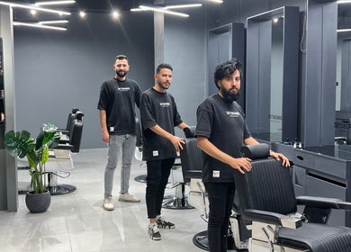 Stylish interior of Jeddah 30 Degrees Barbershop Alnaeem, located in Jeddah, Makkah Province, SA with team.