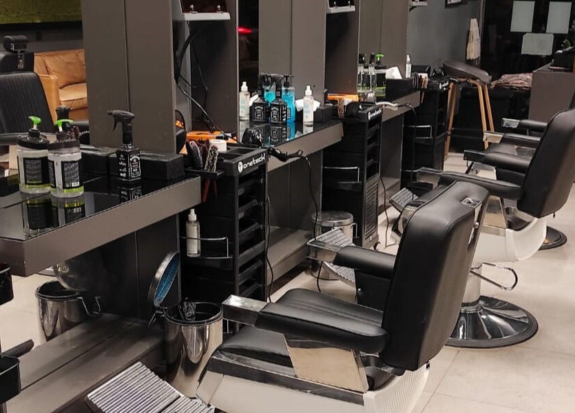 Modern salon interior at Hittin 30 Degrees in Riyadh, Riyadh Province, SA featuring sleek styling chairs and stations.