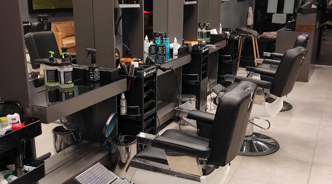 Modern salon interior at Hittin 30 Degrees in Riyadh, Riyadh Province, SA featuring sleek styling chairs and stations.