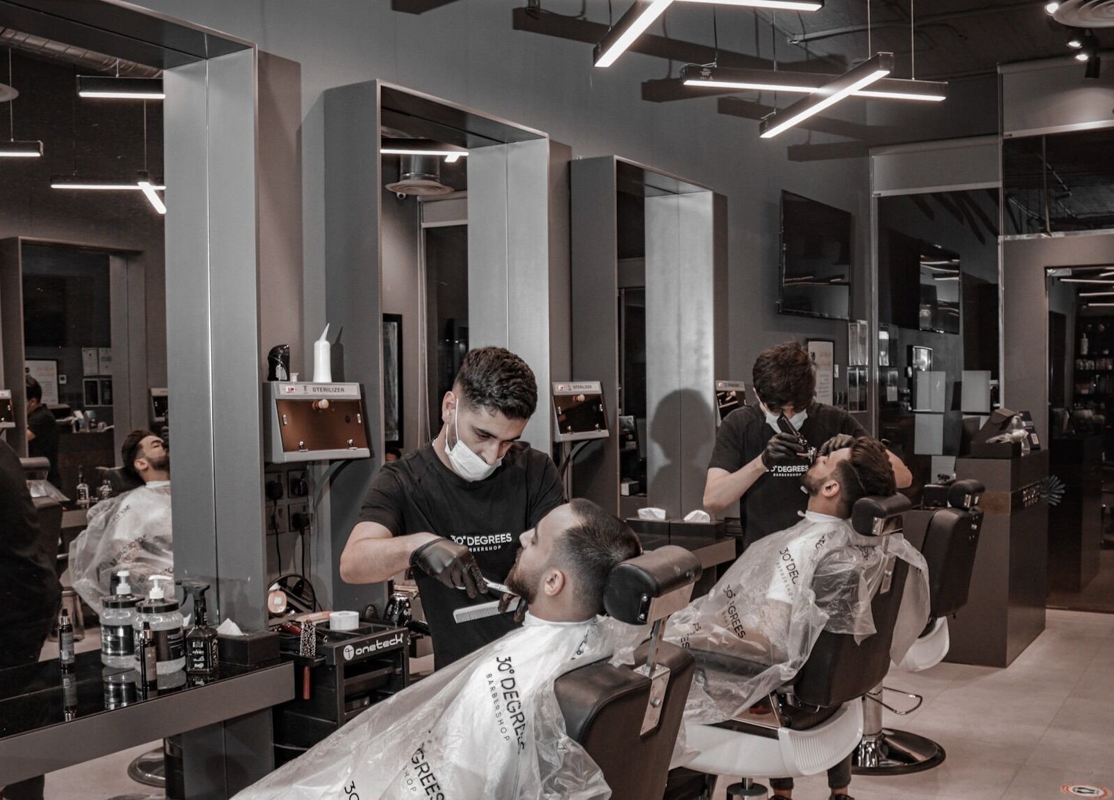 Stylish barbers providing grooming services at Hittin 30 Degrees, Riyadh, Riyadh Province, SA.